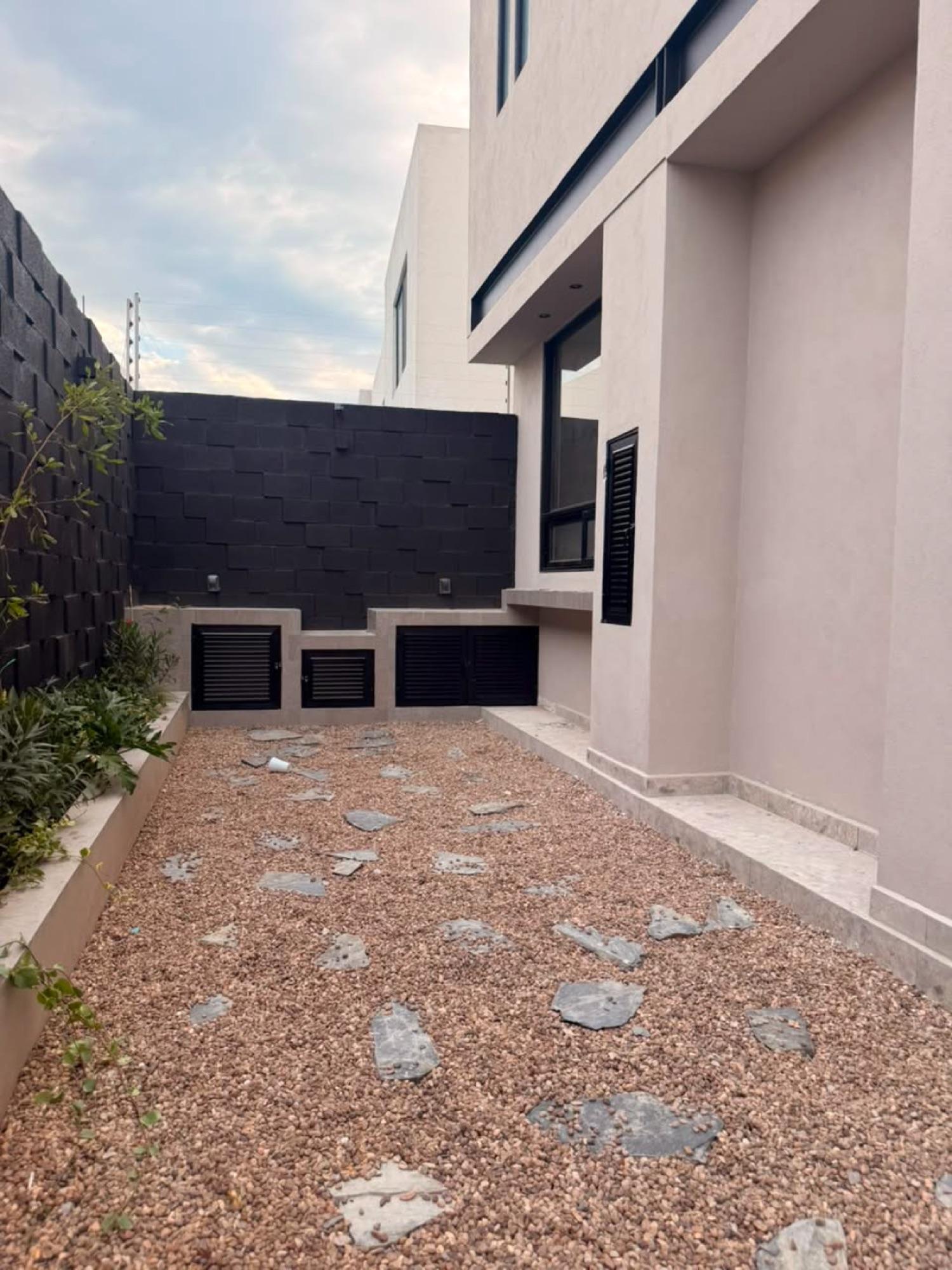 Jardín con asador